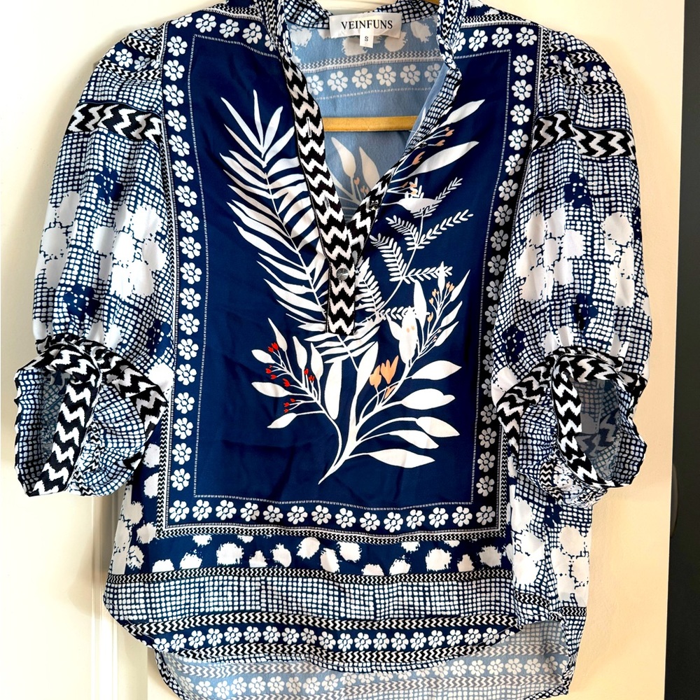 Small blue and white silk floral blouse.
